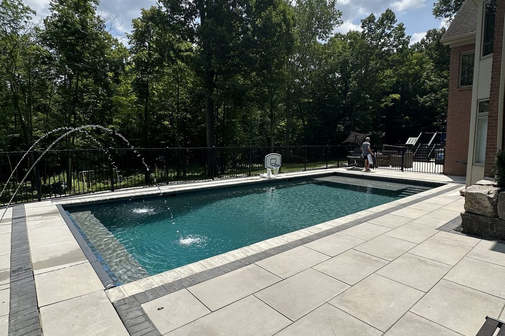 Custom inground pool and paver patio by Exclusive Home Build