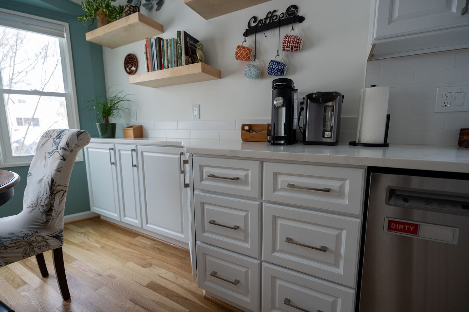 White kitchen remodel with island and pendant lighting