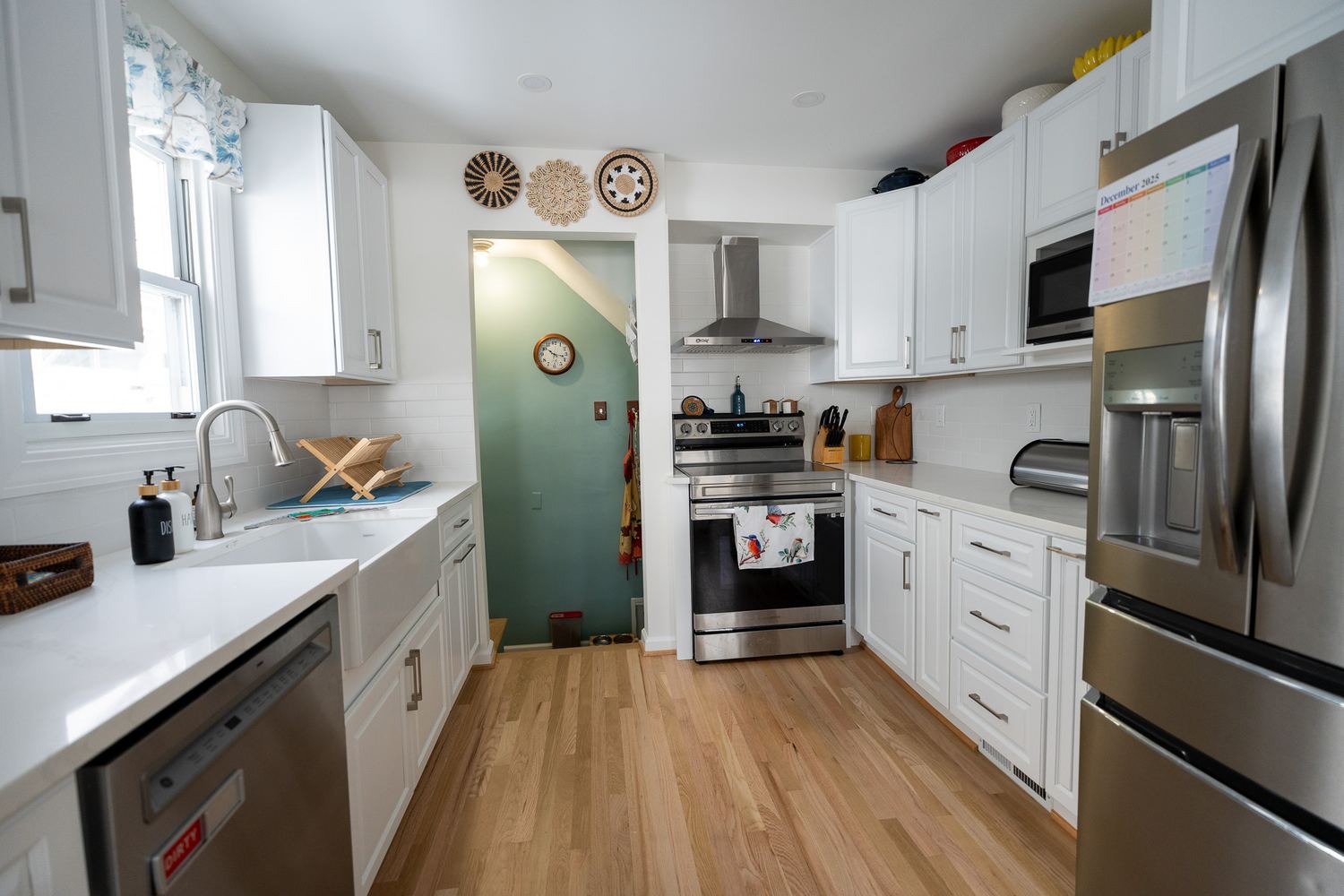 Kitchen with island, stone counters and stainless appliances