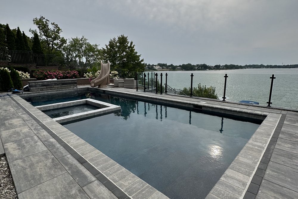 Lakefront pool and patio built by Exclusive Home Build